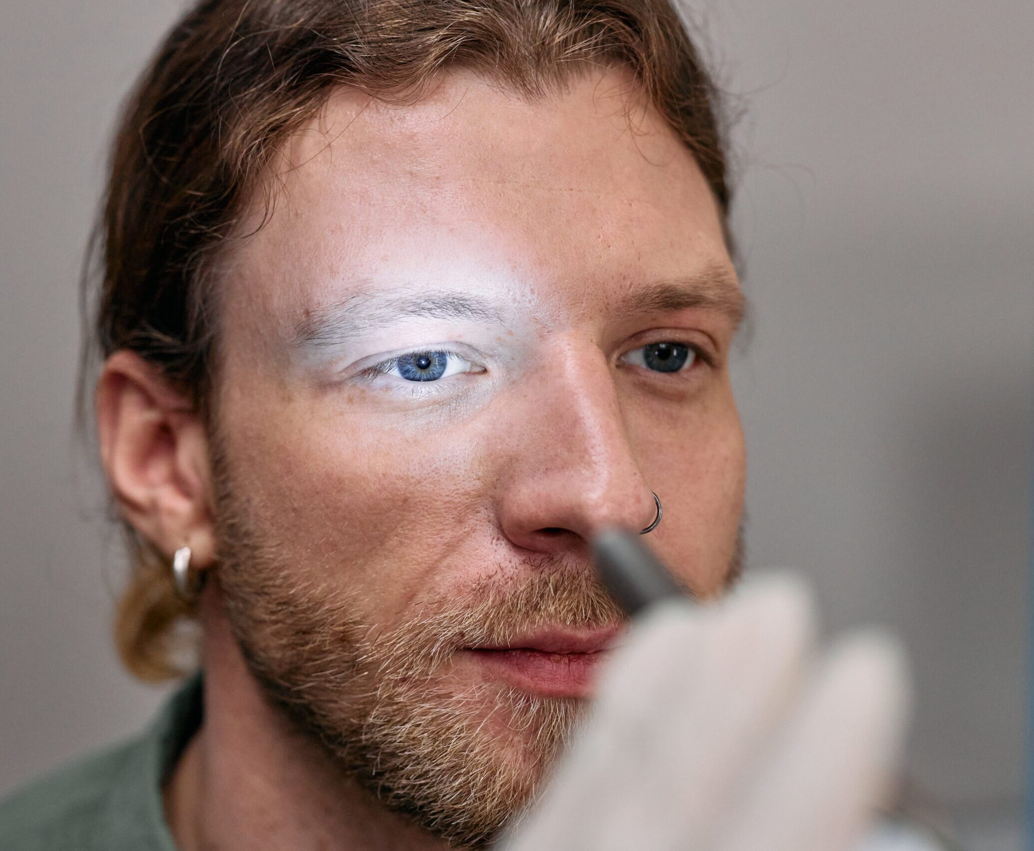 A Man having an Eye Examination